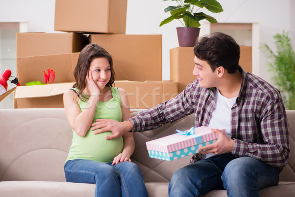 Young couple of man and pregnant wife with giftbox Stock photo © Elnur