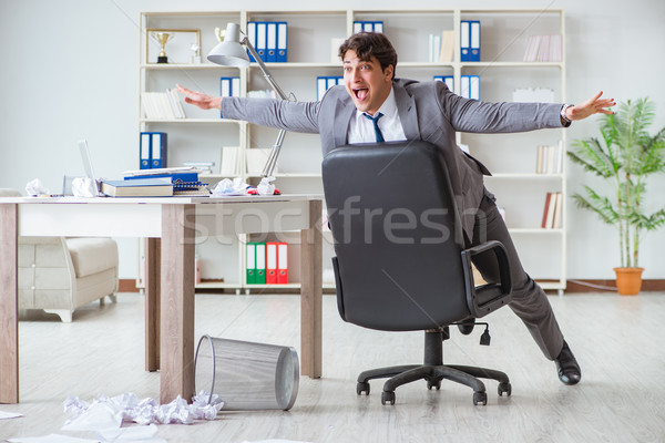 The businessman having fun taking a break in the office at work Stock photo © Elnur