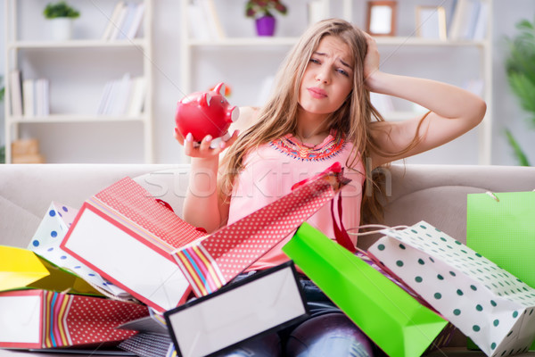 Young woman with shopping bags indoors home on sofa Stock photo © Elnur