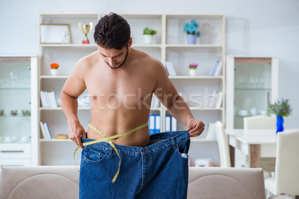Férfi túlméretezett nadrág fogyókúra fitnessz egészség Stock fotó © Elnur