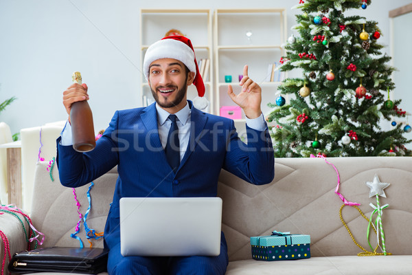 Businessman working at home during christmas Stock photo © Elnur