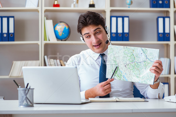 Stock photo: Businessman operator traveling agent working in the office