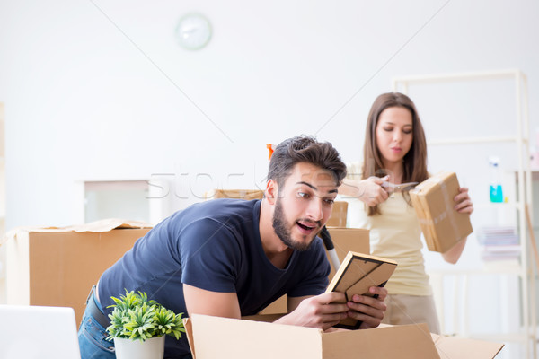 Young family unpacking at new house with boxes Stock photo © Elnur