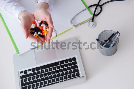 Stock photo: Young woman doing sport exercises isolated on white