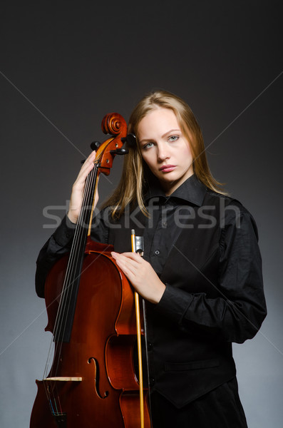Stock photo: Woman playing classical cello in music concept