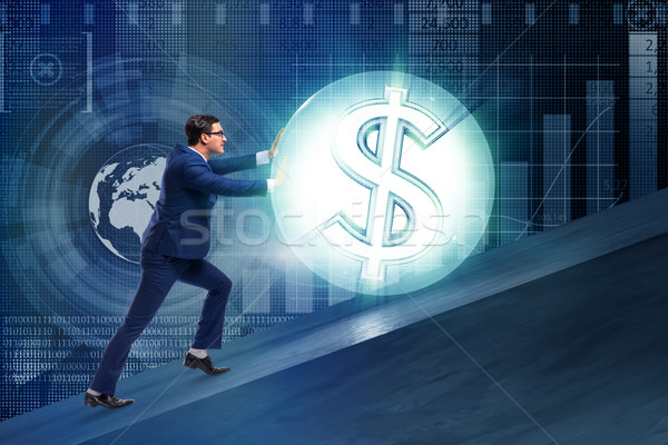 Stock photo: Businessman pushing away dollar ball