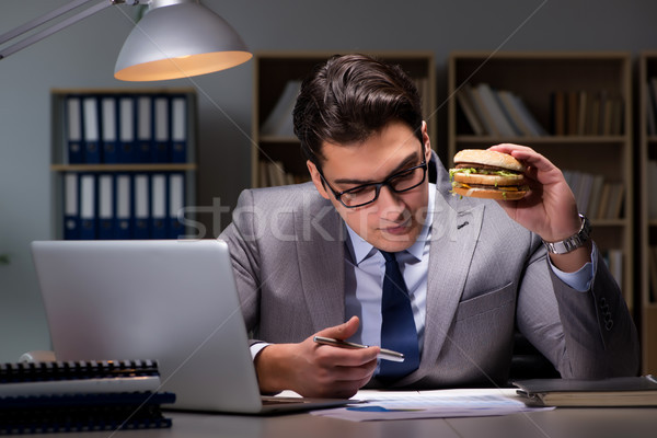 Biznesmen późno noc jedzenie burger działalności Zdjęcia stock © Elnur