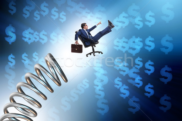 Businessman jumping from spring in promotion concept Stock photo © Elnur