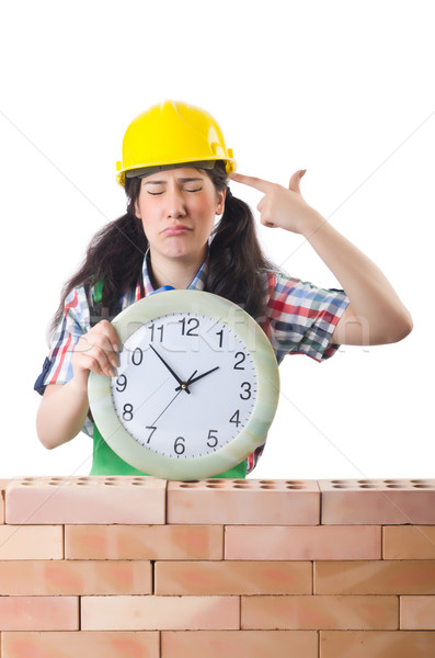 Opóźnienie budowy działalności kobieta ściany zegar Zdjęcia stock © Elnur