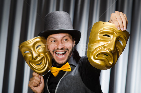 Stock photo: Funny concept with theatrical mask