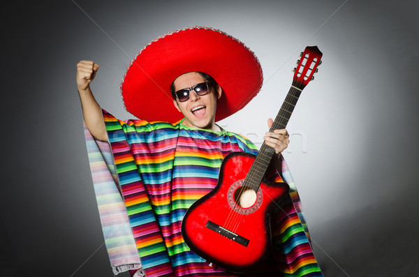 Man in red sombrero playing guitar Stock photo © Elnur