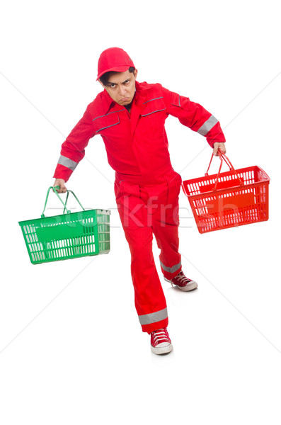 Man in red coveralls with shopping supermarket cart trolley Stock photo © Elnur