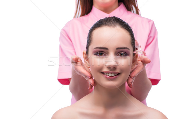 Beautiful young woman during face massage session Stock photo © Elnur