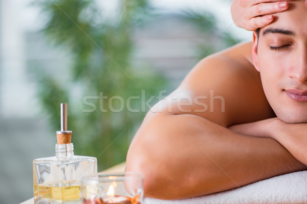 Handsome man during spa massaging session Stock photo © Elnur