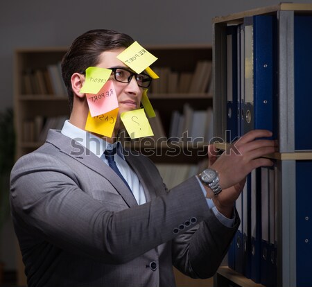 Businessman staying late to sort out priorities Stock photo © Elnur