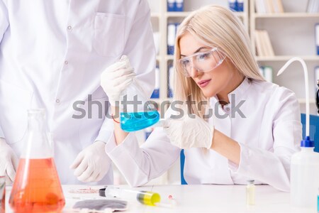 The male doctor working in the lab on virus vaccine Stock photo © Elnur