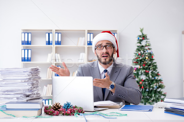 Stock photo: Young businessman celebrating christmas in the office