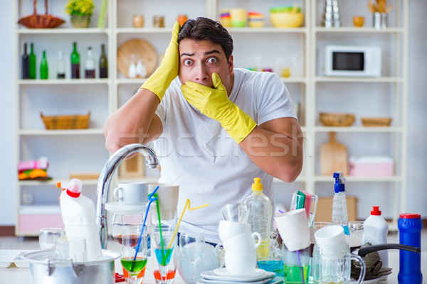 Man frustrated at having to wash dishes Stock photo © Elnur