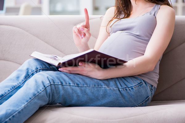 Terhes nő has pocak ül kanapé otthon Stock fotó © Elnur