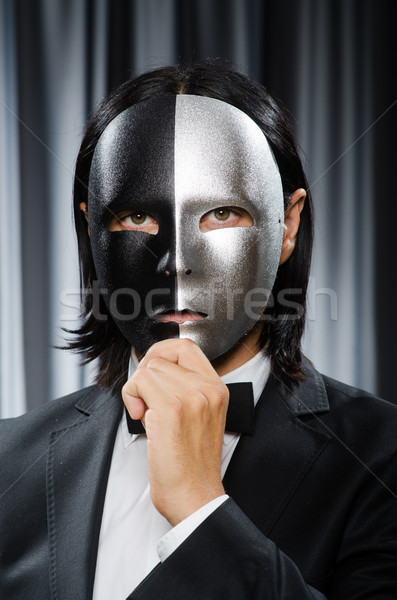 Stock photo: Funny concept with theatrical mask