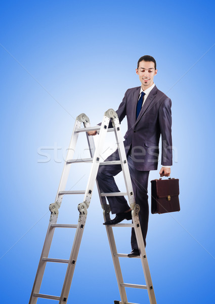 Businessman climbing career ladder against gradient  Stock photo © Elnur