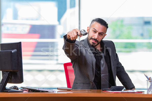 Angry aggressive businessman with gun in the office Stock photo © Elnur