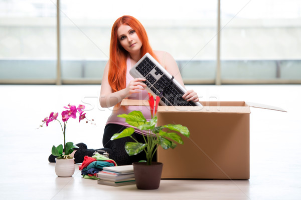 The young woman moving house in lifestyle concept Stock photo © Elnur