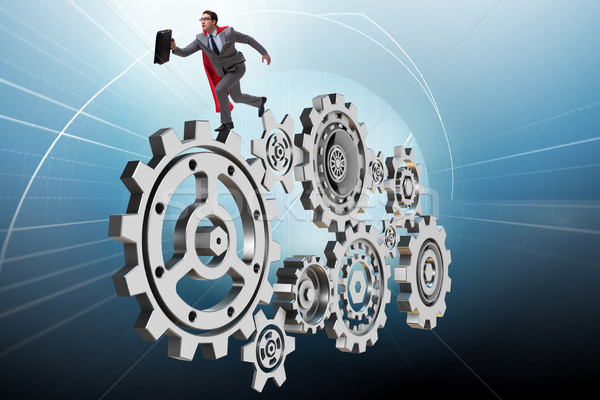 Stock photo: Businessman in teamwork concept with cogwheels