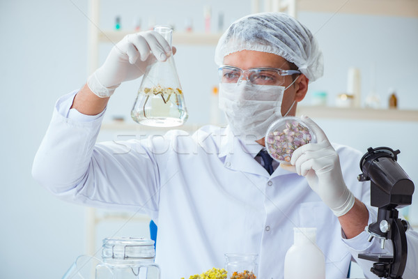 Chemik laboratorium człowiek butelki kobiet chemia Zdjęcia stock © Elnur