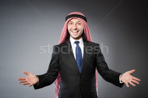 Arab businessman againt grey background Stock photo © Elnur