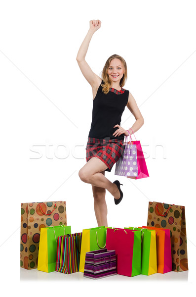 Stock photo: Young woman after shopping isolated on the white