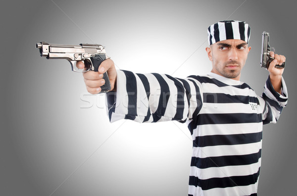 Prisoner with gun isolated on white Stock photo © Elnur