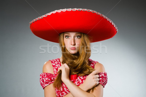 Stock photo: Mexican woman wearing red sombrero