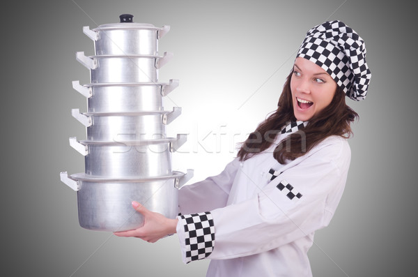 Cook with stack of pots on white Stock photo © Elnur