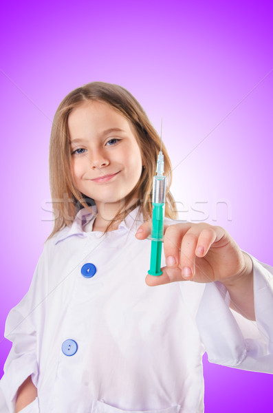 Little doctor with syringe Stock photo © Elnur