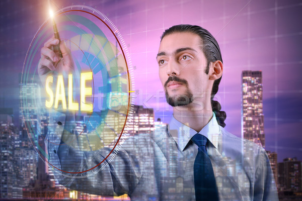 Young handsome businessman in sales concept Stock photo © Elnur