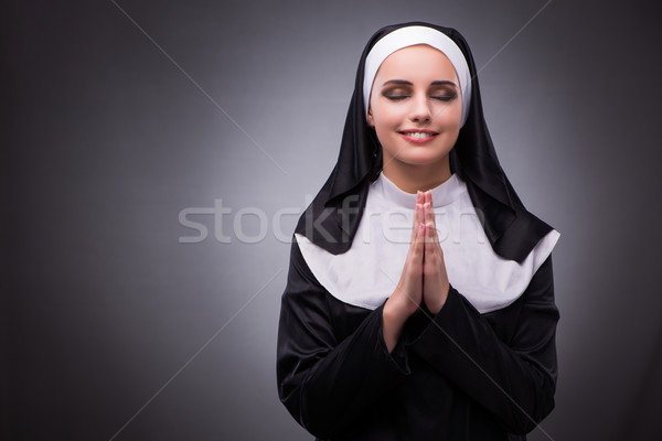 Religious nun in religion concept against dark background Stock photo © Elnur