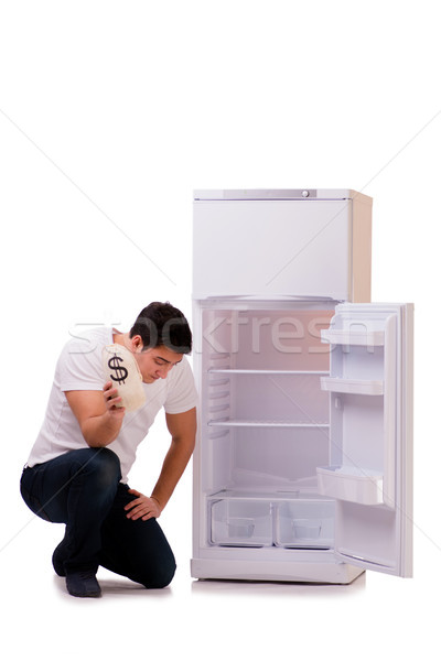 голодный человека глядя деньги холодильник бизнеса Сток-фото © Elnur