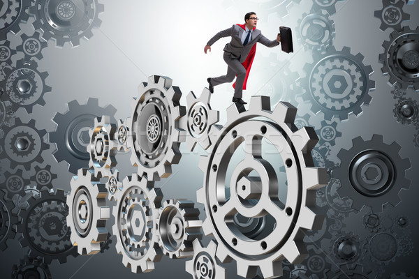 Businessman in teamwork concept with cogwheels Stock photo © Elnur