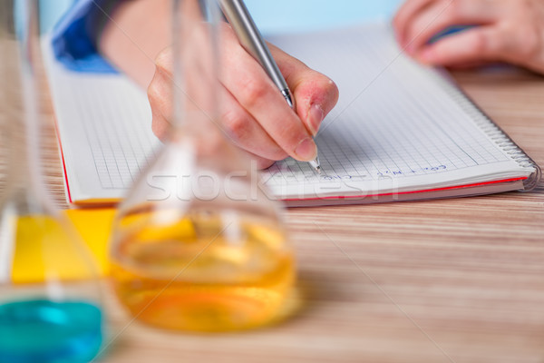 Experienced lab assistant working on chemical solutions Stock photo © Elnur