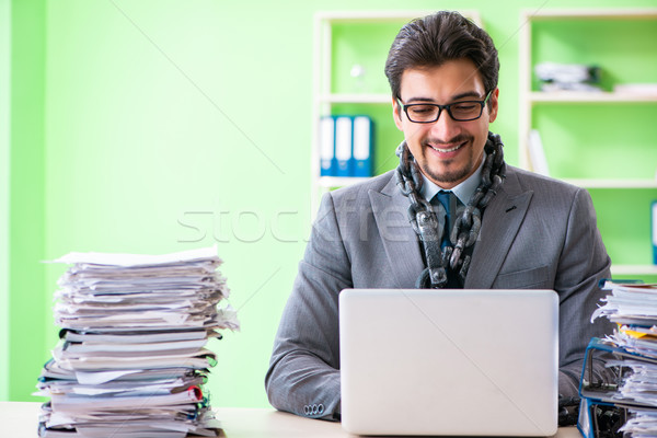 Employee chained to his desk due to workload Stock photo © Elnur