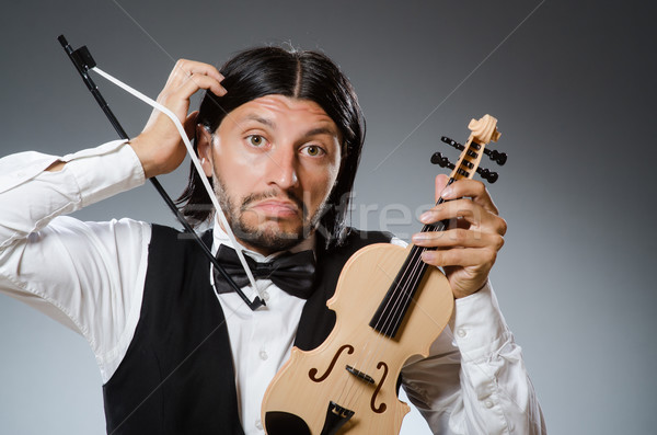 Funny fiddle violin player in musical concept Stock photo © Elnur