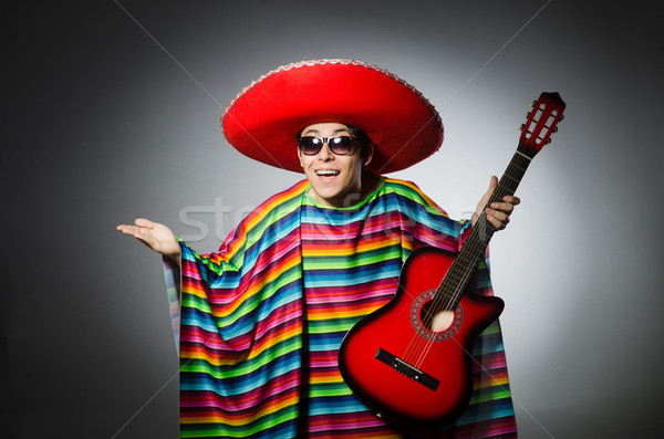 Man in red sombrero playing guitar Stock photo © Elnur