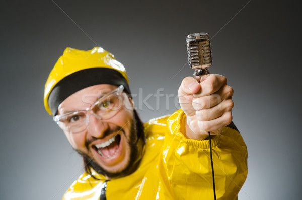 Man wearing yellow suit with mic Stock photo © Elnur