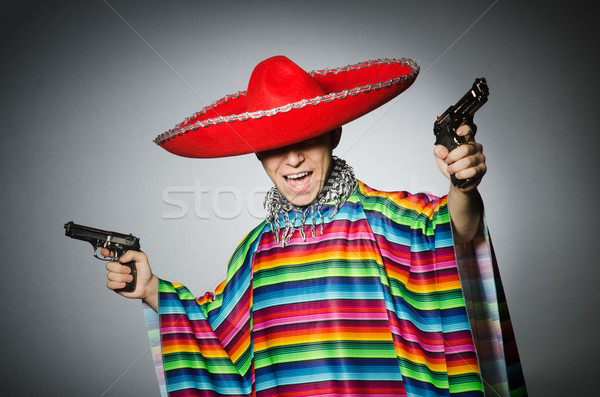 Férfi élénk mexikói tart kézifegyver szürke Stock fotó © Elnur