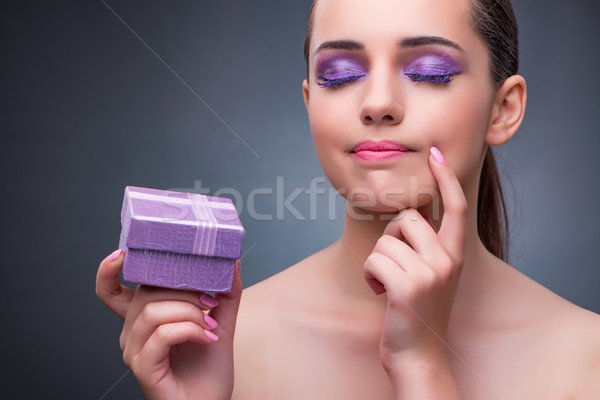 Young woman receiving small giftbox Stock photo © Elnur