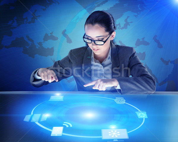 Businesswoman in global computing concept Stock photo © Elnur