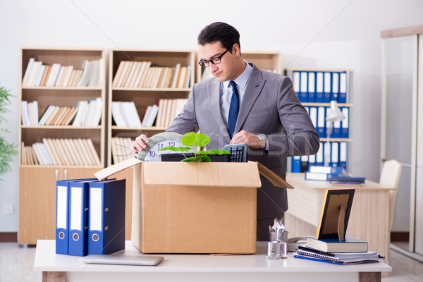 The young businessman moving offices after being made redundant Stock photo © Elnur