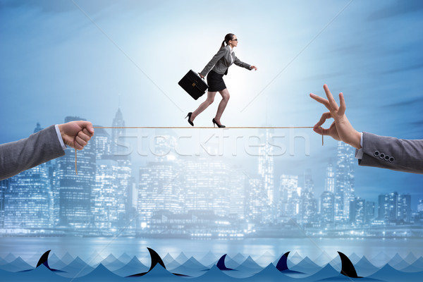 Businesswoman walking on tight rop in business concept Stock photo © Elnur
