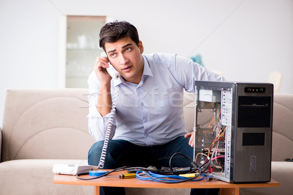 Angry customer trying to repair computer with phone support Stock photo © Elnur